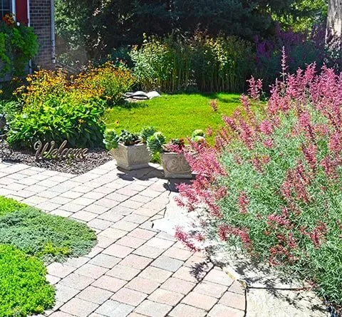 Reliable lawn care service with custom design across Arvada, CO - Outdoor Lifestyles