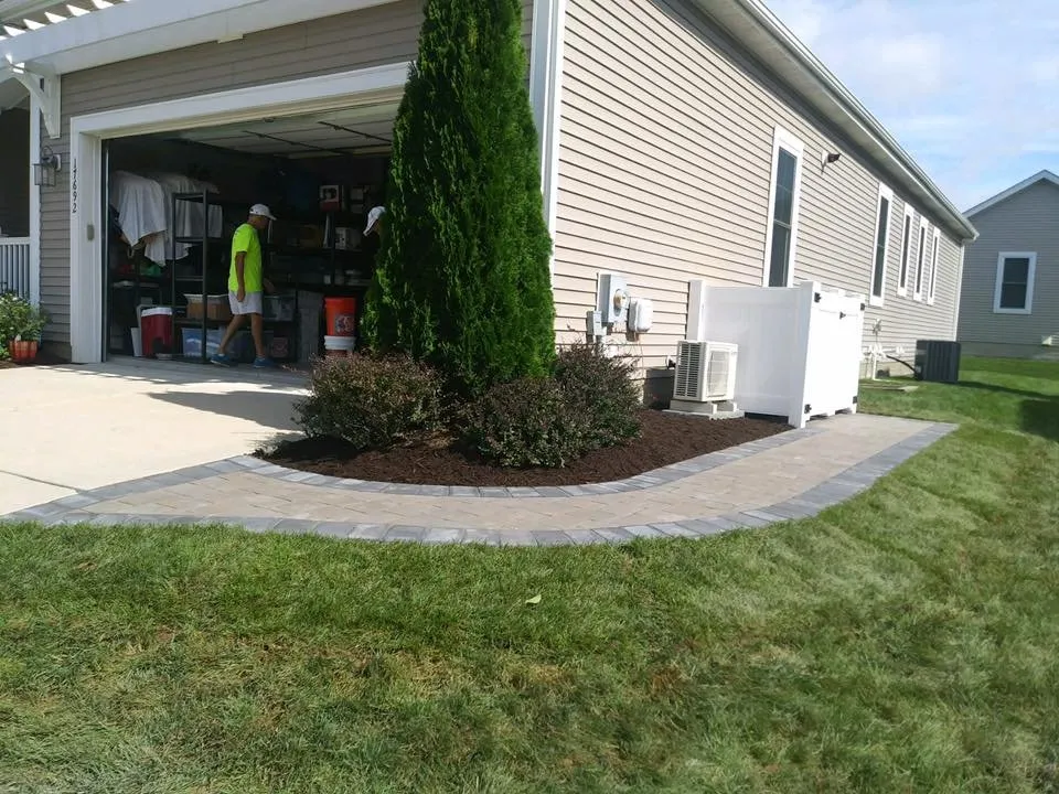 Affordable lawn care service for residential properties in Milton, DE by OUTDOOR LIVING HARDSCAPES