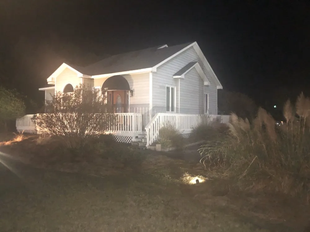 Affordable outdoor landscaping with custom design in Emerald Isle, NC by Outdoor Solutions