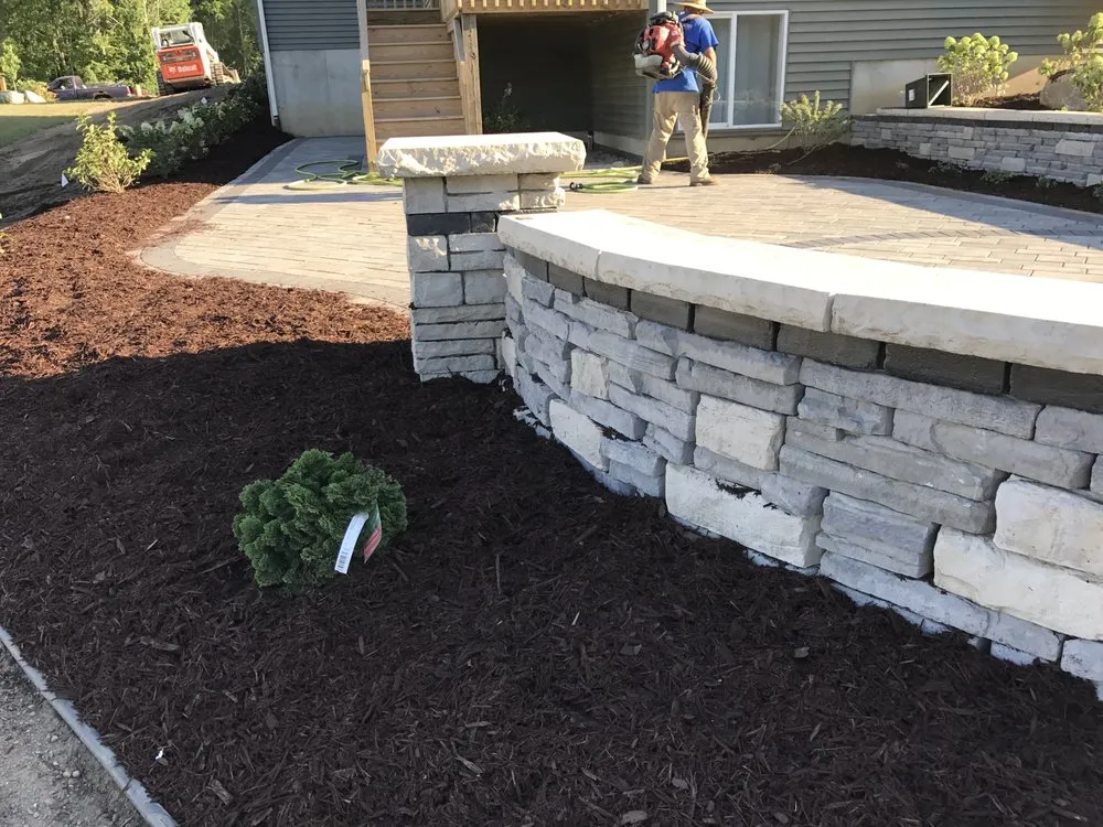 Top-rated lawn mowing service with custom design across Lansing, MI - Outdoor Specialties