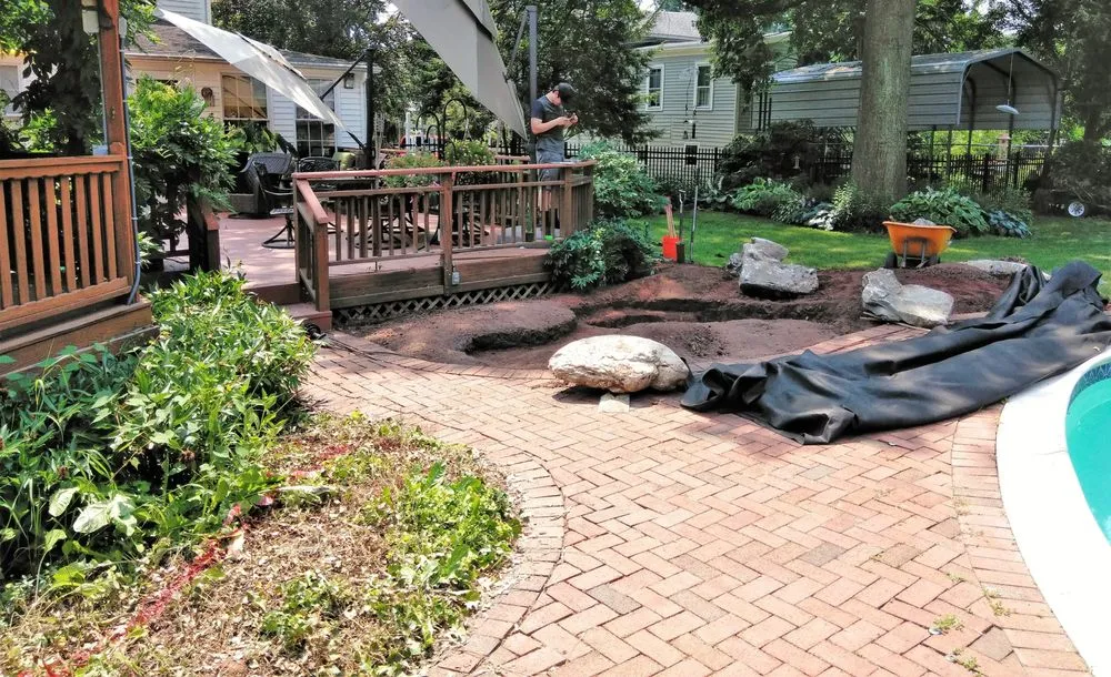 Professional lawn care service for residential properties in East Brunswick, NJ by Outdoorspaces Landscape Design & Build Services