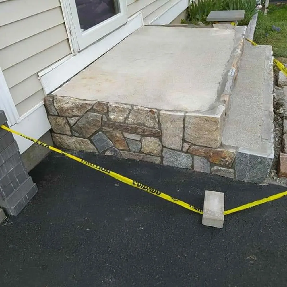 Professional lawn care service for outdoor upgrades in Branford, CT by Over the Hedge Masonry & Landscaping