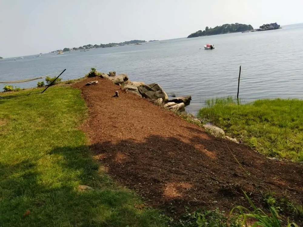 Top-rated lawn mowing service for beautiful yards in Branford, CT by Over the Hedge Masonry & Landscaping