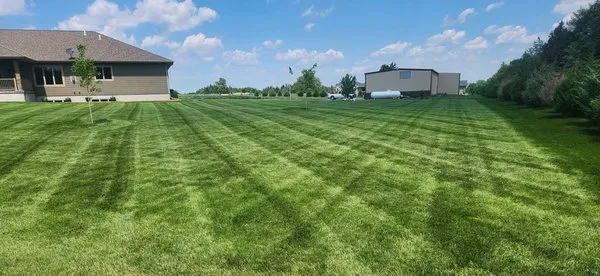 Overtime Lawn Care Logo