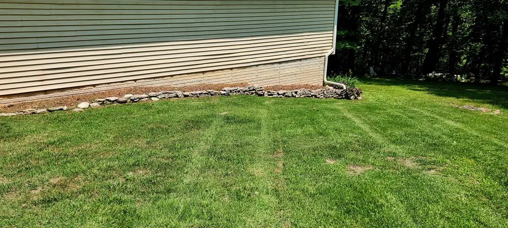 Custom yard cleanup service for residential properties in Roach, MO by Ozark Mowing