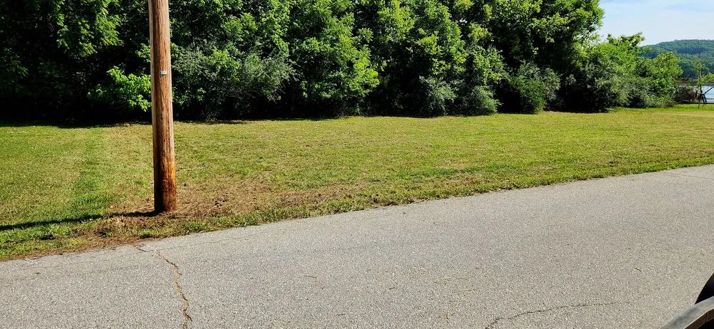 Custom residential landscaping for homes in Roach, MO by Ozark Mowing