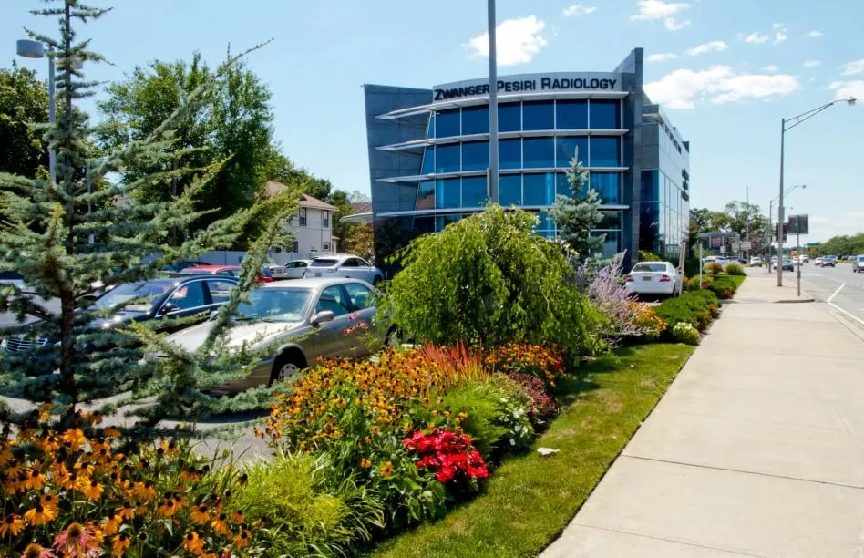 Custom yard maintenance for outdoor upgrades in Island Park, NY by Paccione & Sons Landscaping