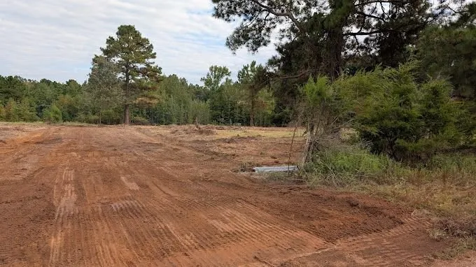 Affordable landscape installation for residential properties in Gilmer, TX by Pafford Land & Home