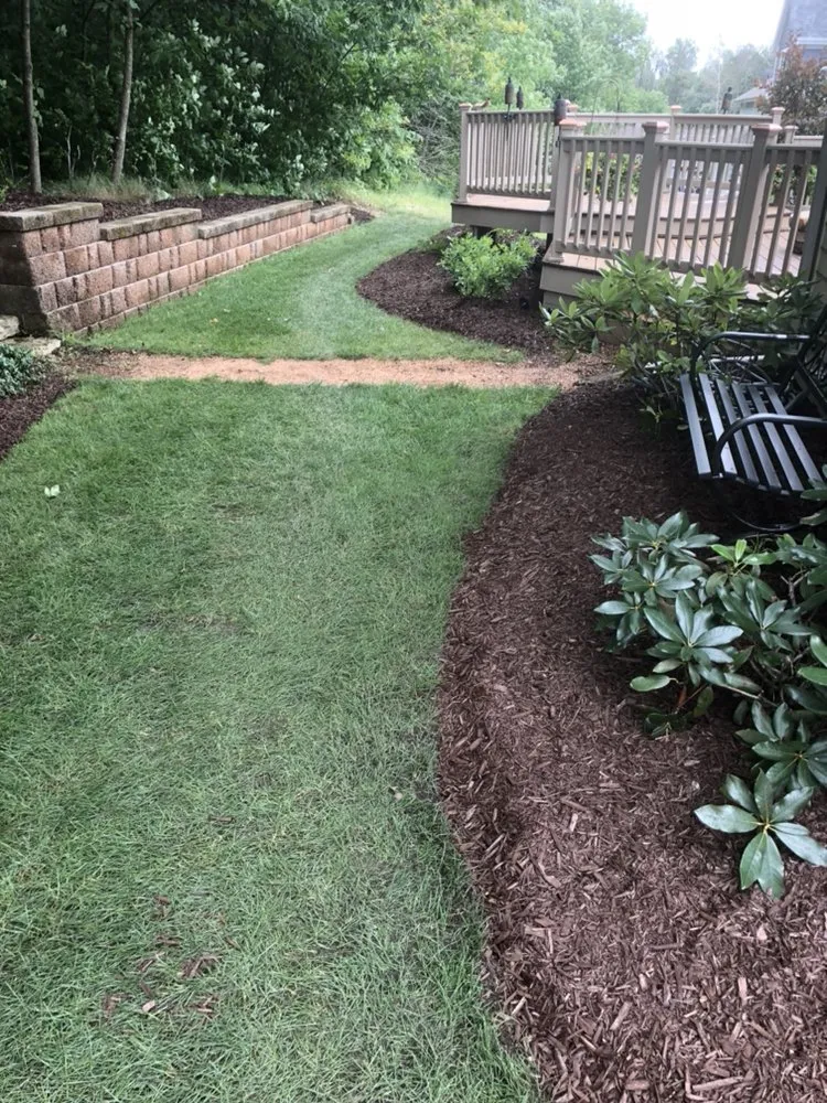 Expert yard maintenance with custom design across West Bend, WI - Paradise Lawnscapes