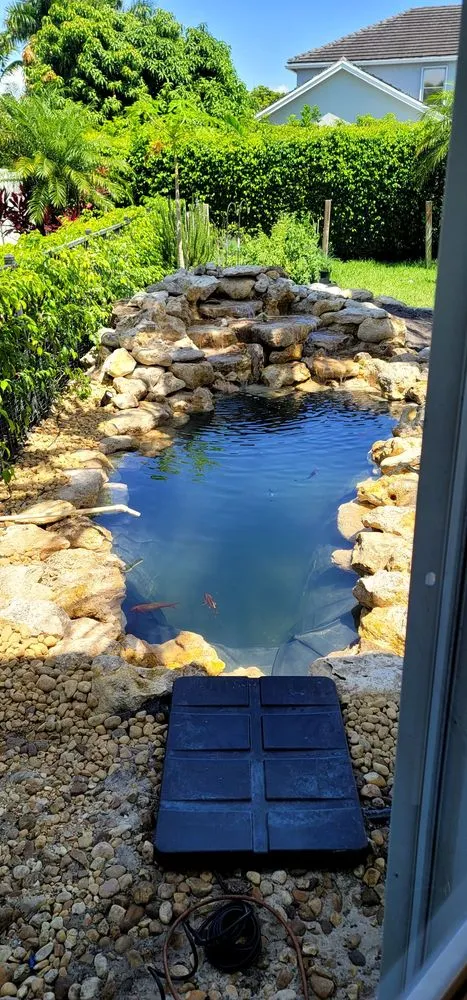 Custom landscape installation for beautiful yards in West Palm Beach, FL by Parkers Ponds