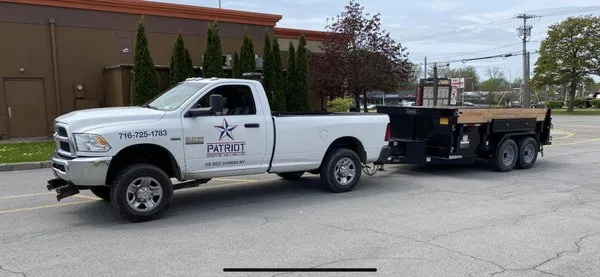 Patriot Snowplow And Lawncare Logo