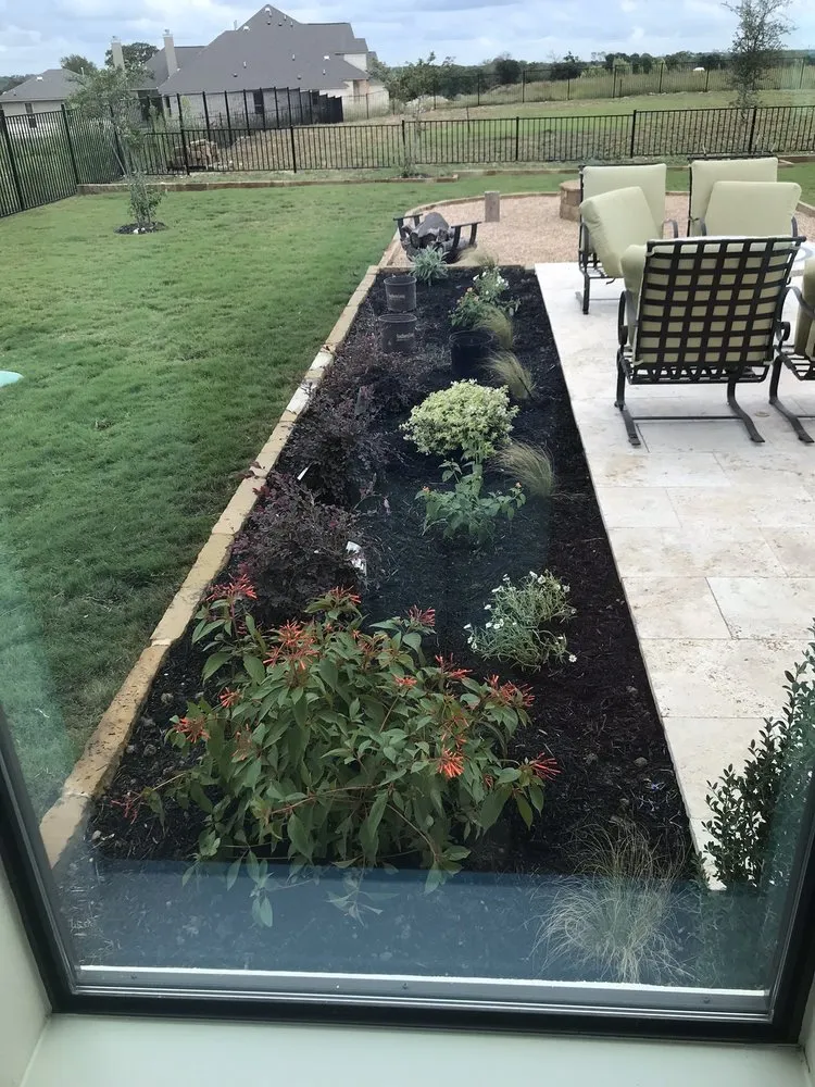 Professional outdoor landscaping with custom design in Leander, TX by Paul's Lawn & Landscape