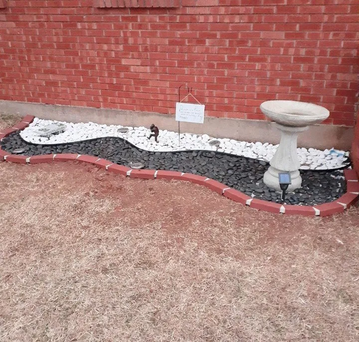 Custom residential landscaping for year-round maintenance in Moore, OK by Paul's Lawn and Tree Service