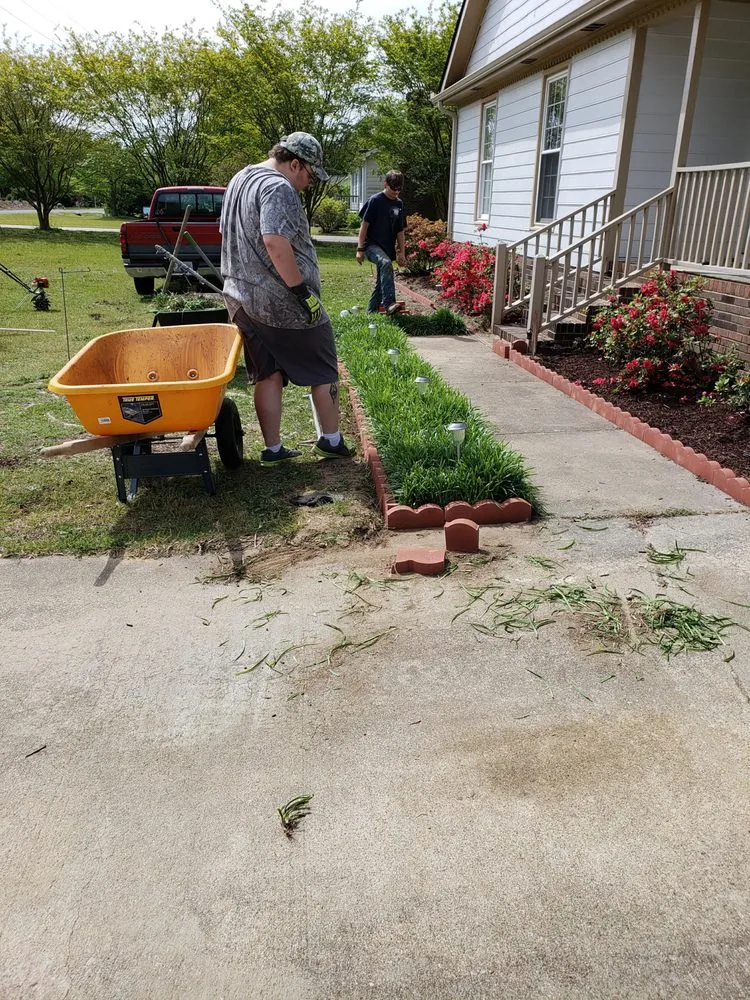 Custom lawn care service with custom design across Youngsville, NC - Paw Paws Landscaping and Lawn Services