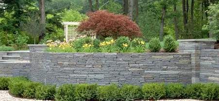 Custom landscaping services for homes in Round Lake, NY by Peak Environmental