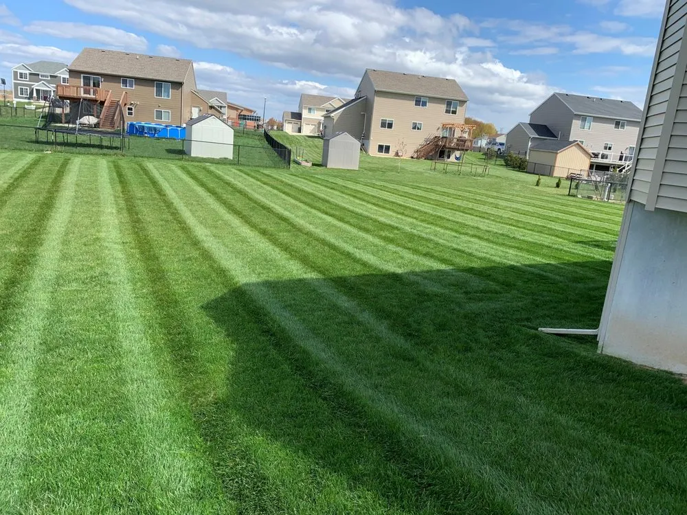 Expert lawn mowing service for homes in Grandville, MI by Peak Outdoor Services