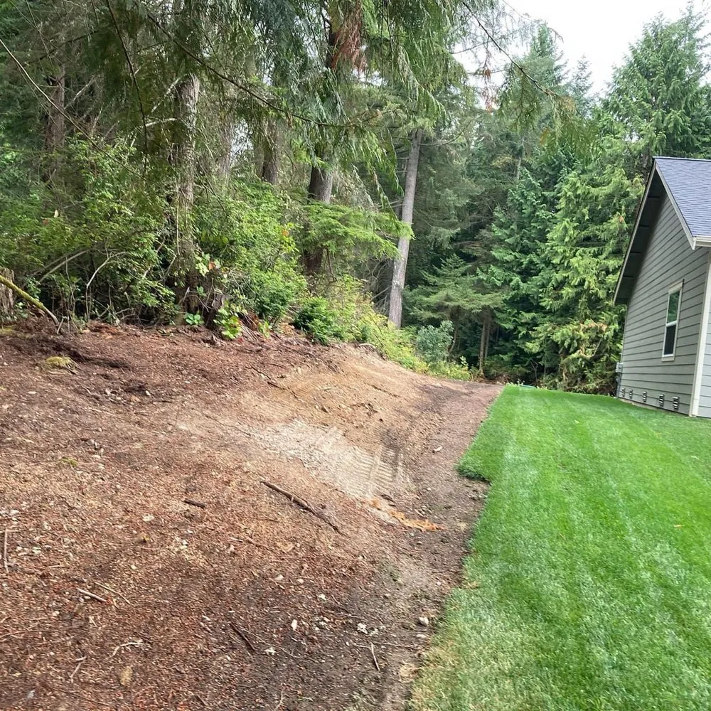 Custom lawn mowing service for residential properties in Belfair, WA by Pelican Landscaping