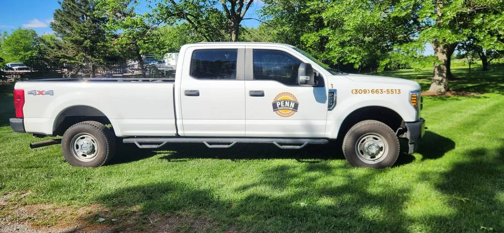 Affordable yard cleanup service for homes in Bloomington, IL by Penn Construction And Comprehensive Design