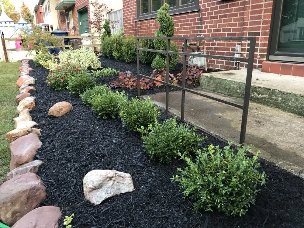 Professional garden landscaping for year-round maintenance in Buffalo, NY by Percy's Lawn Care and Son