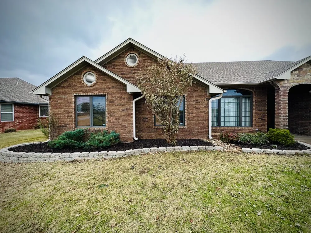 Custom outdoor landscaping with custom design in Edmond, OK by Perfection Yards Landscaping