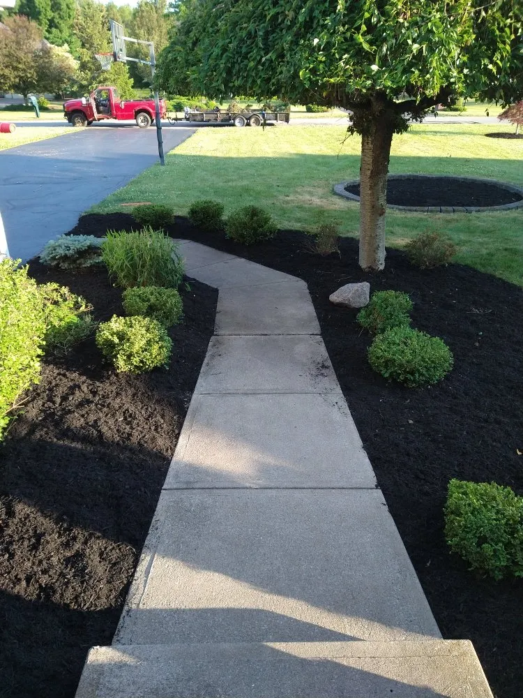 Affordable lawn care service for year-round maintenance across Irondequoit, NY - Pike's Plowing and Landscape