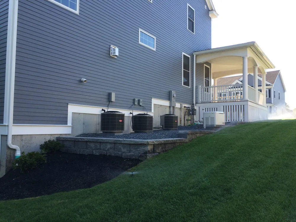 Trusted lawn care service for beautiful yards in Billerica, MA by Pineau Landscape Construction