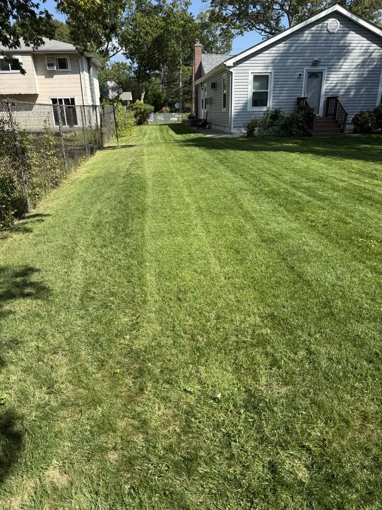 Custom landscape design for beautiful yards in Brentwood, NY by Pineda Landscaping
