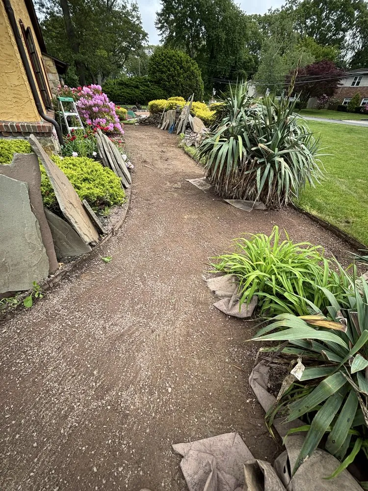 Custom lawn care service for year-round maintenance in Melville, NY by PJ's Contracting