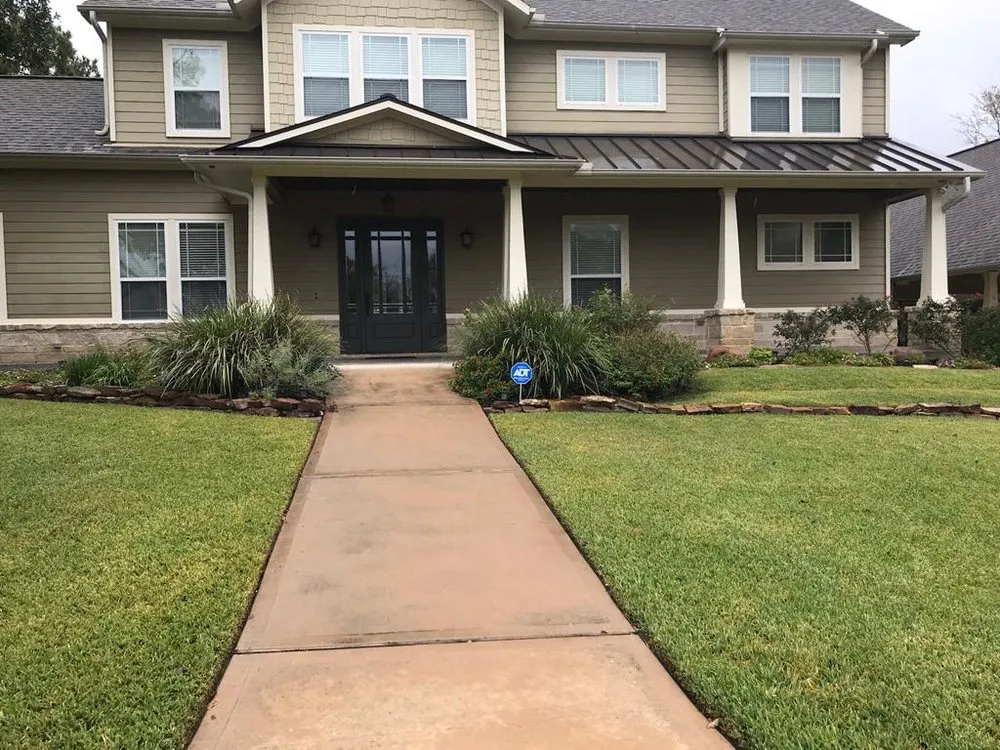 Local lawn mowing service with custom design in Bellville, TX by Planet Landscape