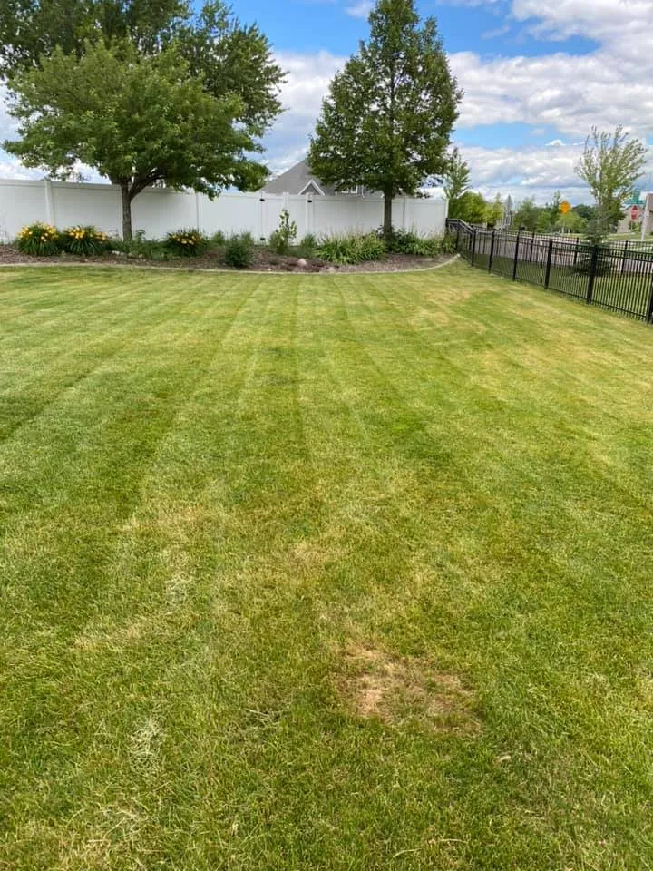 Local landscape design with custom design in Rochester, MN by Platz Lawn & Services