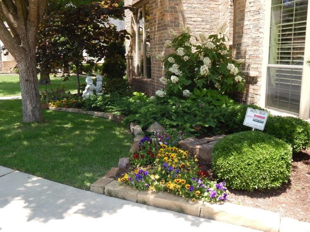 Professional lawn mowing service for year-round maintenance in Carrollton, TX by PLM Landscaping and Outdoor Living