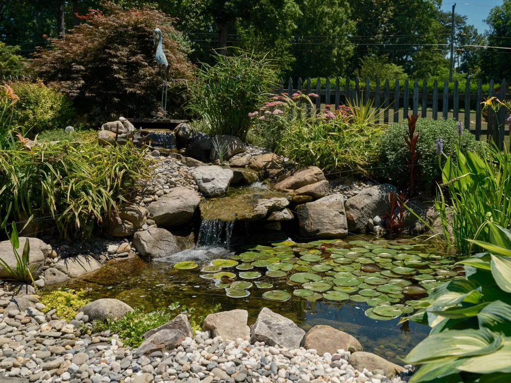 Professional landscape installation with custom design in Colfax, NC by Pond Country