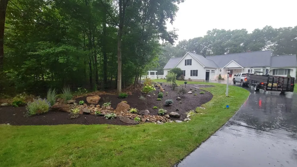 Custom outdoor landscaping in Bellingham, MA by Pond Hollow Landscape & Design