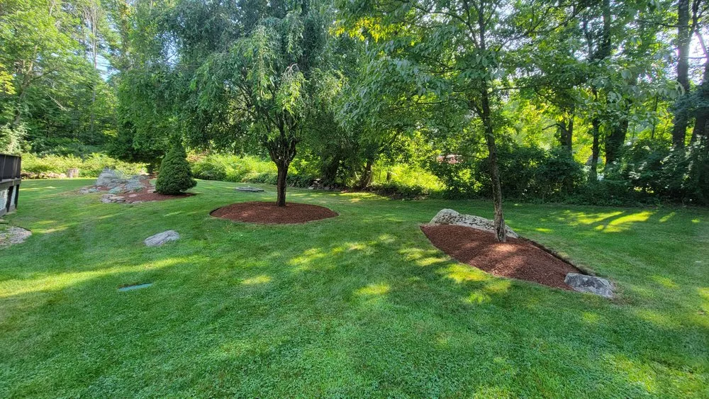 Professional landscaping services for residential properties in Bellingham, MA by Pond Hollow Landscape & Design