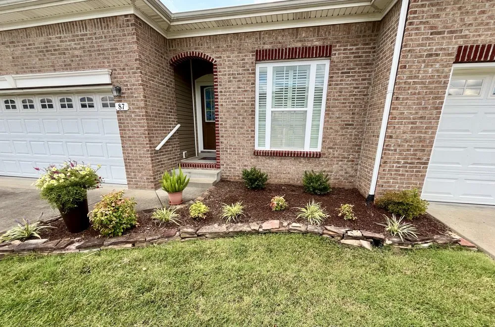 Professional outdoor landscaping for homes in Clarksville, TN by Poof Trash Services