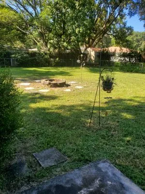 Pooh's Lawncare Logo