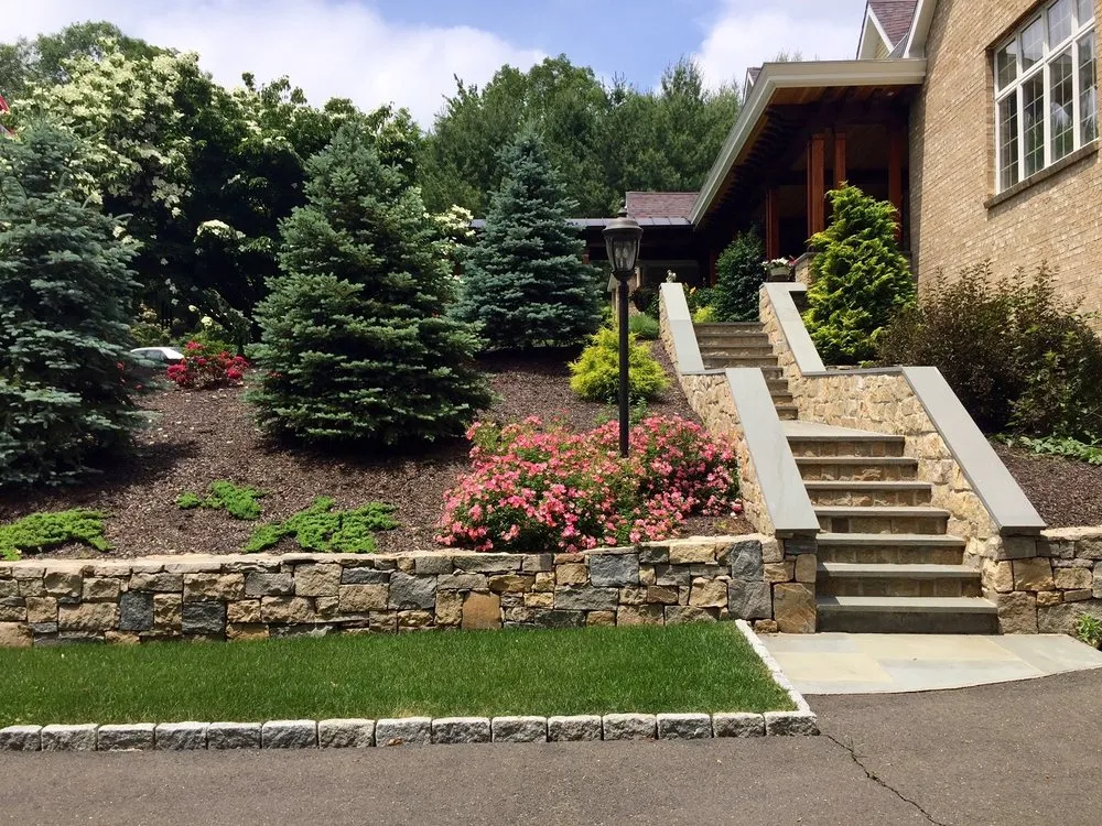 Professional lawn mowing service for residential properties across Woodbridge, CT - POPEL Landscaping and Design