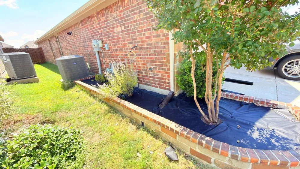 Expert lawn care service for residential properties across Garland, TX - Porch Fencing and Landscaping