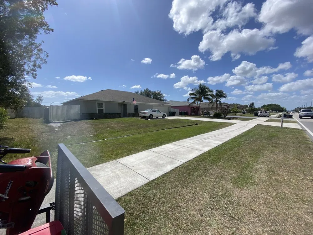 Custom lawn mowing service with custom design in Port St. Lucie, FL by Portes & Sons