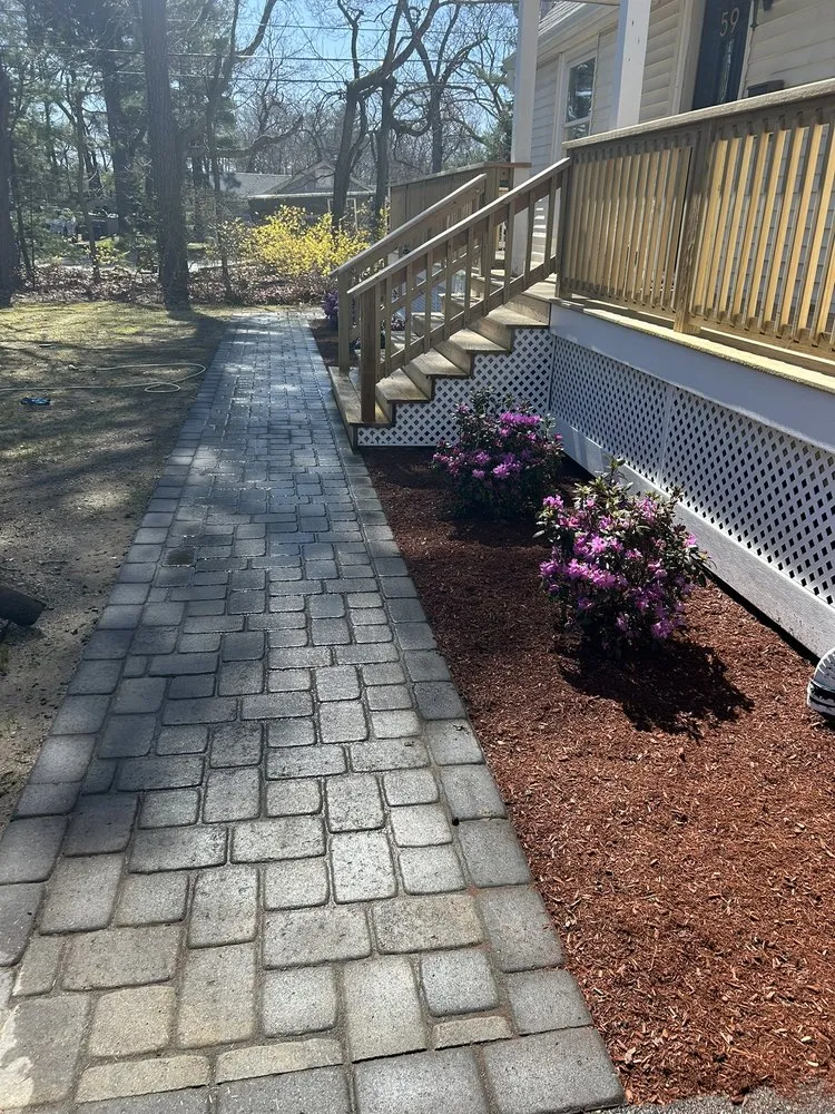 Local lawn mowing service with custom design in Marlborough, MA by Poyatos Landscaping