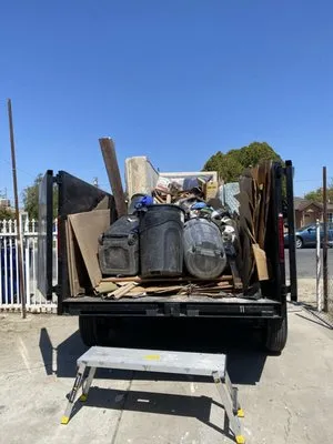 Prados Hauling Junk Logo