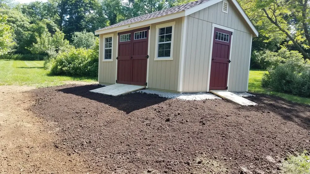 Custom yard cleanup service for year-round maintenance in Goshen, CT by Prause Enterprises