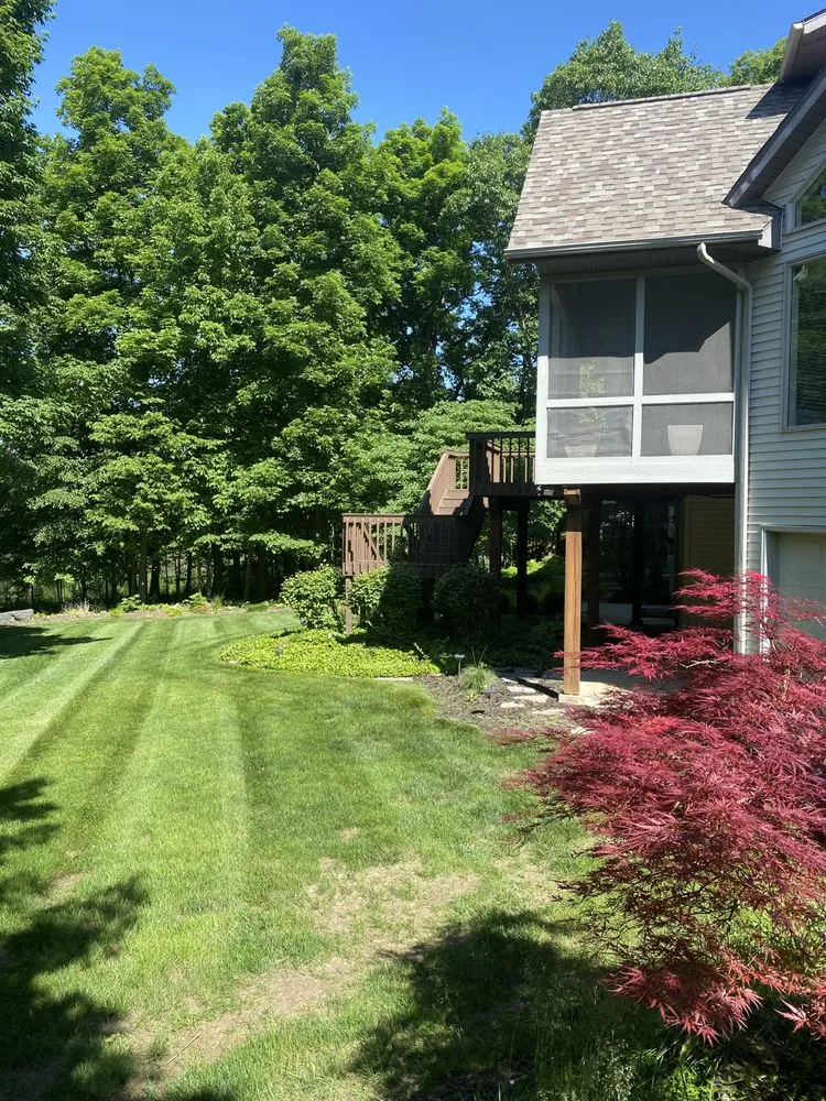 Professional yard cleanup service for residential properties in Fort Wayne, IN by Precision Cuts Landmaintenace