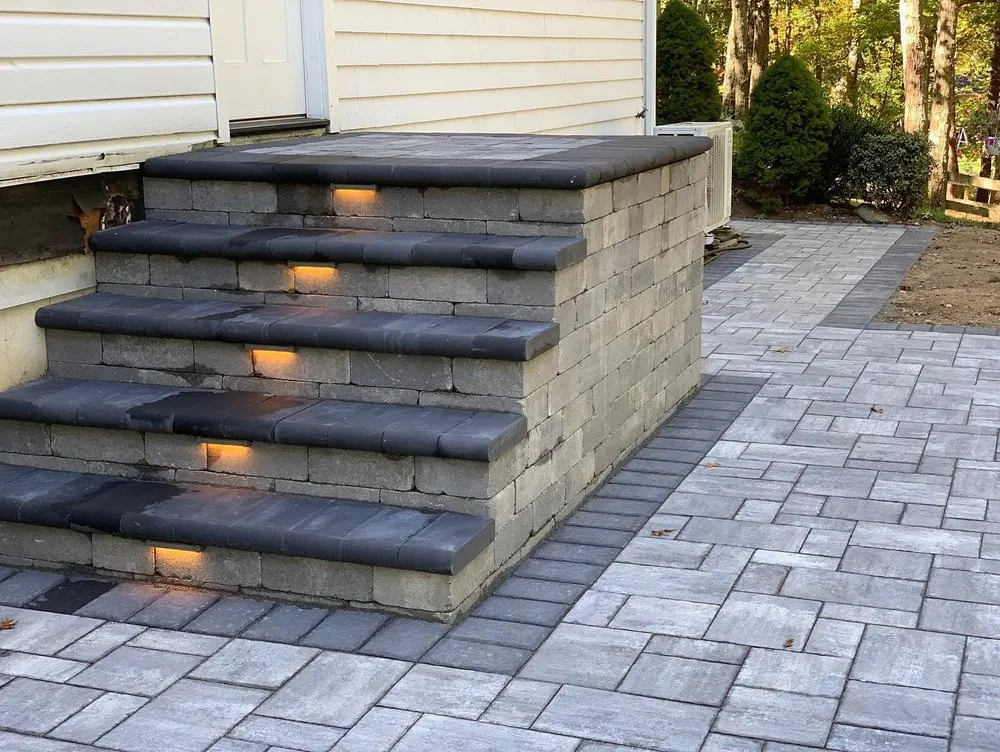 Expert landscaping services for beautiful yards in Bohemia, NY by Precision Enterprises