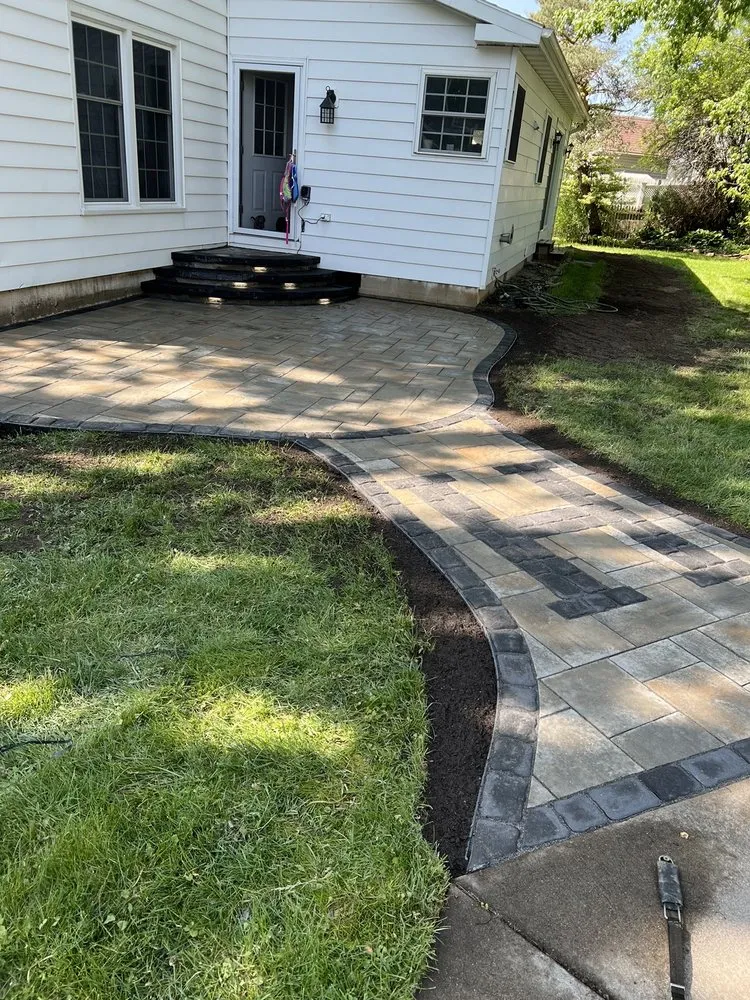 Expert lawn mowing service for outdoor upgrades in Baldwinsville, NY by Precision Pavers