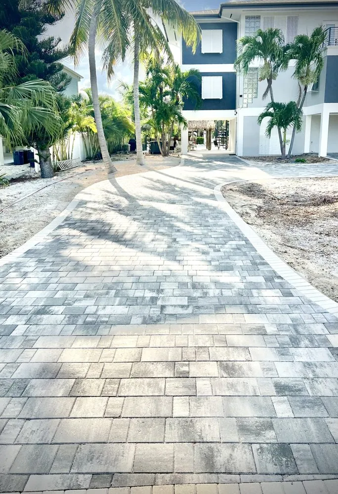 Affordable yard cleanup service for year-round maintenance in Islamorada, FL by Precision Pavers