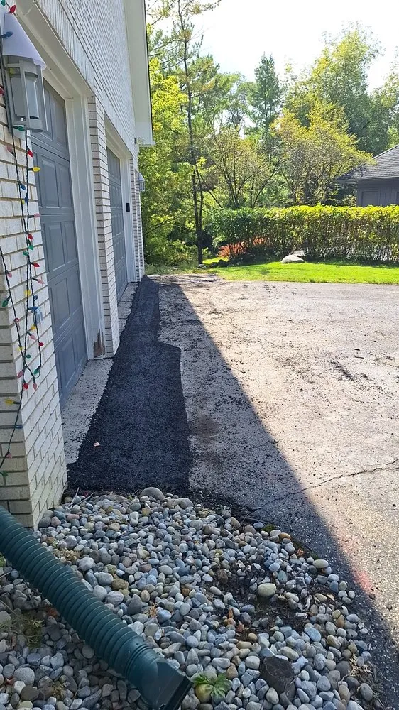 Custom yard cleanup service in Waterford Township, MI by Precision Paving and Sealing