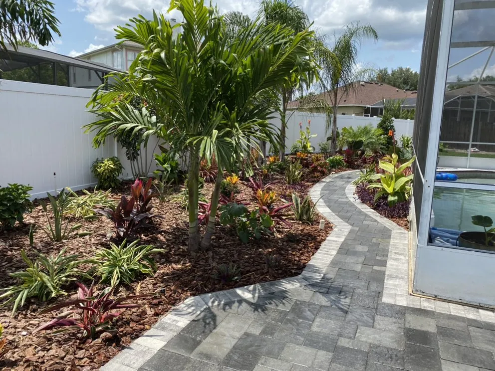 Custom landscape design for year-round maintenance in Oviedo, FL by Preferred Landscape of Central Florida