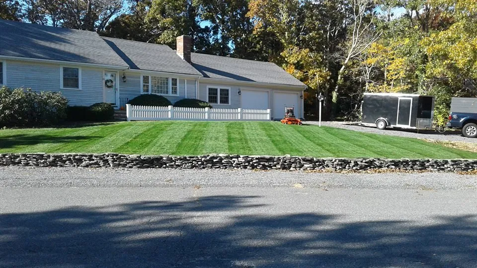 Expert lawn mowing service with custom design across Yarmouth Port, MA - Pride
