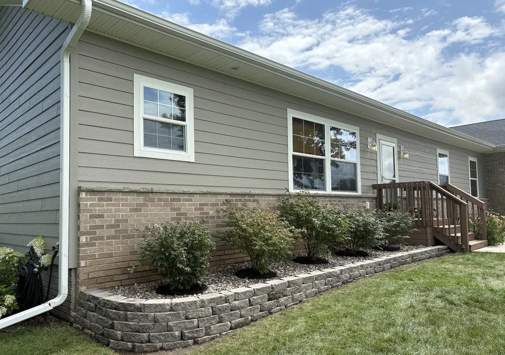 Affordable residential landscaping for year-round maintenance in Waukee, IA by Prime Surface Solutions